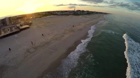 Flying over a beach at sunset Stock Footage 51185757