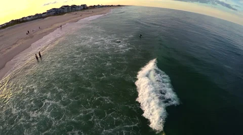 Flying over a beach at sunset Stock Footage 51185822