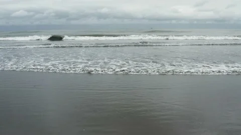 Flying over the beach towards open water of the Pacific Ocean Stock Footage 146345209