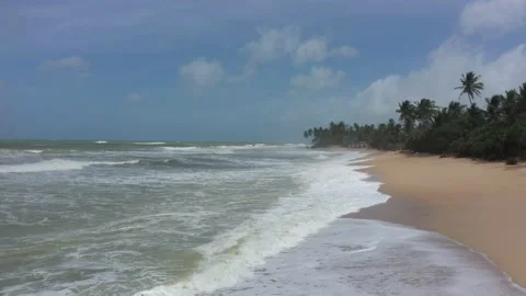 Flying over the beach with waves Stock Footage 202701348