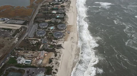 Flying over beachfront residential area west of Shinnecock County Park, Long Stock Footage 59173303