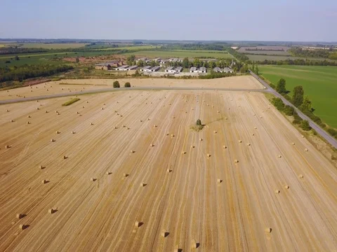 Flying over beautiful field with bale of hay. Aerial drone footage 4k Stock Footage 78420585