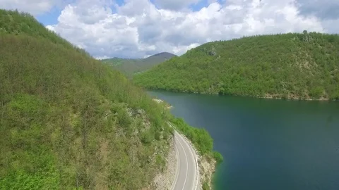 Flying over beautiful green mountain and river Stock Footage