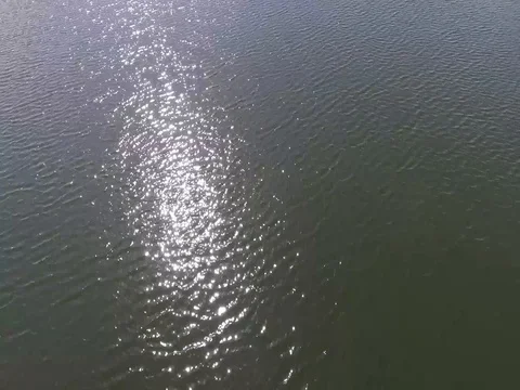 Flying over beautiful green waves sparkling in sunlight Stock Footage 75425063