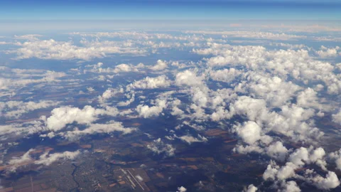 Flying over beautiful heaps of white clouds moving softly from right to left. Stock Footage 113502194