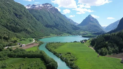 Flying over beautiful landscape with water, river and mountains in Norway Stock Footage 157697113