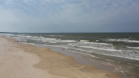 Flying over beautiful sandy beach aerial seaside landscape with sea and waves Stock Footage 116493314