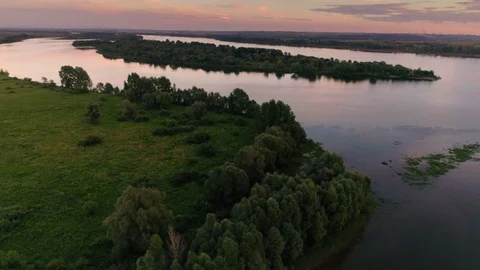 Flying over beautiful valley with calm pond and amazing dense green trees and Stock Footage 101385341
