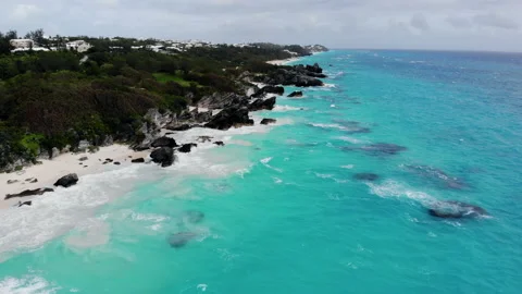 Flying over the beautiful white sand beach of Bermuda with breathtaking Stock Footage 133201139