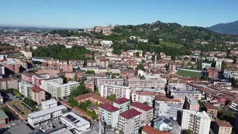 Flying over Bergamo towards the upper city, aerial view of the Italian city c Stock Footage 154477744