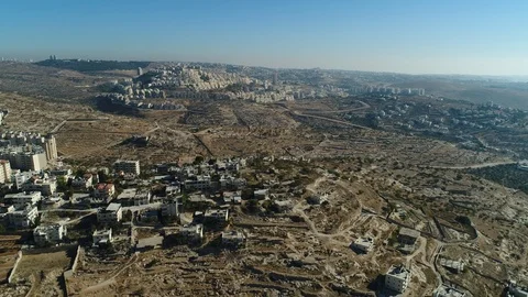 Flying over Bethlehem toward Har Homa neighborhood of Jerusalem. DJI_0082-05 Stock Footage 104496611