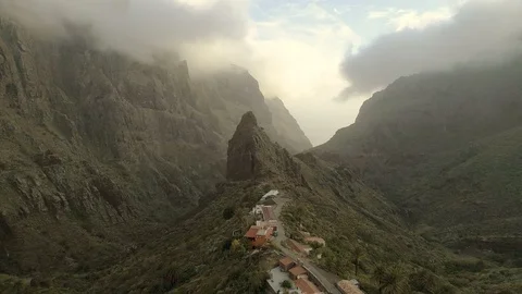 Flying over big deep canyon towards mountain peak. Masca, Tenerife, Spain Stock Footage 90810126