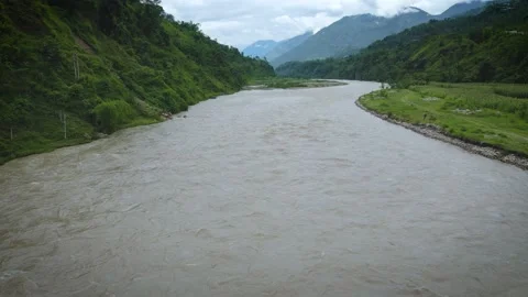 Flying over big mountain river in west Nepal, aerial drone view Stock Footage 155960562