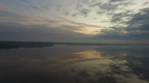 Flying over the big river at dawn. Panoramic aerial view Video stock 63503702