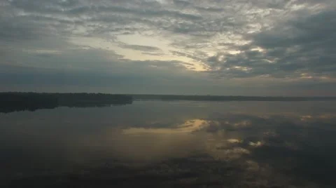Flying over the big river at dawn Stock Footage 63503724