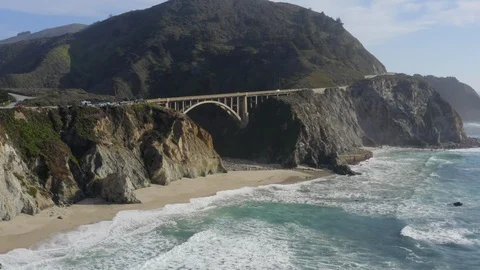 Flying Over Big Sur Beach Coast and Towards Bixby Creek Bridge on State Route 1 Stock Footage 121111615