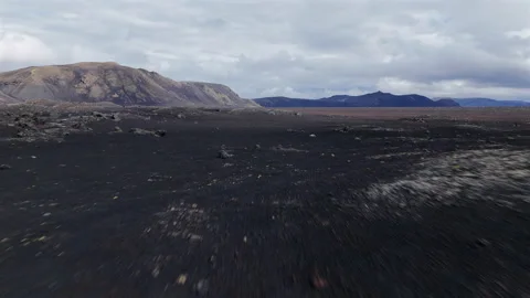 Flying Over Black Lava Rocks FPV View Stock Footage 319700136