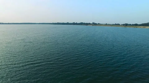 Flying over the blue lake Stock-Footage 66273221