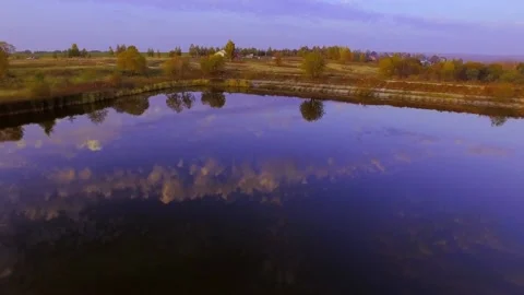 Flying over a blue lake Stock Footage 89772160