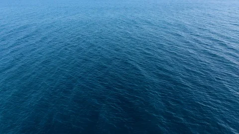 Flying over the blue surface of the sea or ocean Video stock 113801657