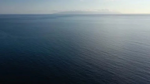 Flying over the blue surface of the sea or ocean Video stock 143699886