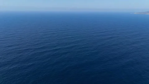 Flying over the blue surface of the sea or ocean Stock Footage 278893712
