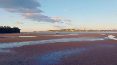 Flying over a boat at low tide Stock Footage
