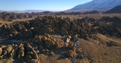Flying over boulders in the mountains Stockbeeldmateriaal 77702672