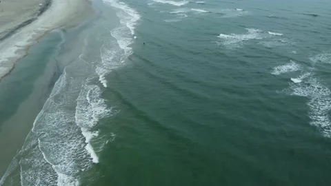 Flying over the breaking waves along the Atlantic coast in winter Stock Footage 172435462