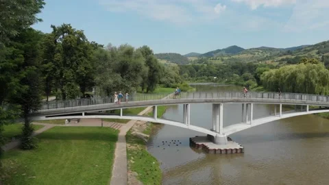 Flying over bridge across Poprad river in Piwniczna-Zdroj, Poland Stock Footage 139732254