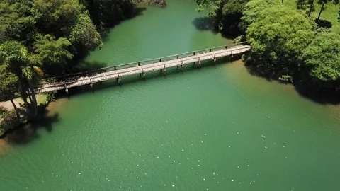 FLYING OVER BRIDGE AND FOREST Stock Footage 84069650