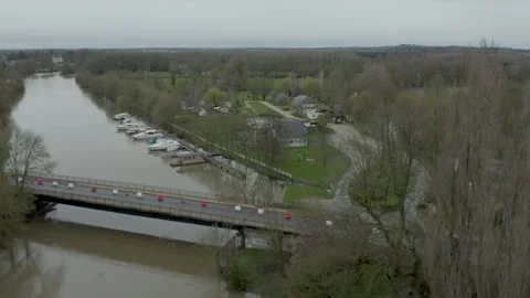 Flying over a bridge at La Sarthe river in France Video stock 266535448