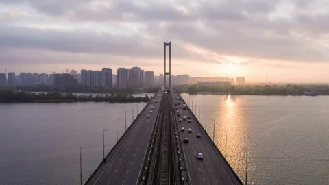 Flying over the bridge over the river 스톡 동영상 166929084
