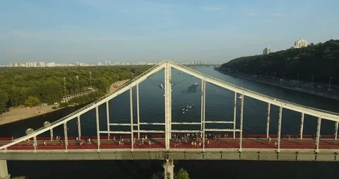 Flying Over Bridge Pylon. Pedestrian Walking Over The River Stock Footage 95335845