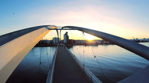 Flying over bridge at sunset. modern futuristic architecture. blue hour Stock Footage 36175453