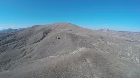 Flying up over the brown hills Stock Footage 86788075