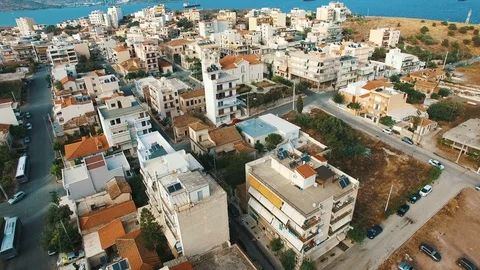 Flying over builings of small town in southern Europe at sunset. Stock Footage 87075675