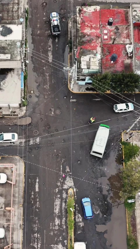 Flying over bumpy roads in Ecatepec, Mexico. Vertical shooting Stock Footage 293771674