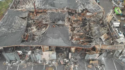 Flying over Burnt Down Industrial Warehouse, Collapsed roof, Aerial Vídeos de archivo 143725704