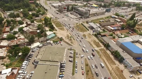 Flying over the bustling thoroughfare of the big city during the day Stock Footage 83096652