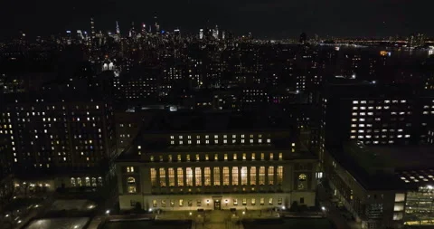 Flying over the Butler Library towards the Manhattan skyscrapers , night Stock Footage 235468219