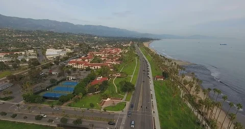 Flying over Cabrillo Boulevard on Santa Barbara, California coast Stock Footage 73199520