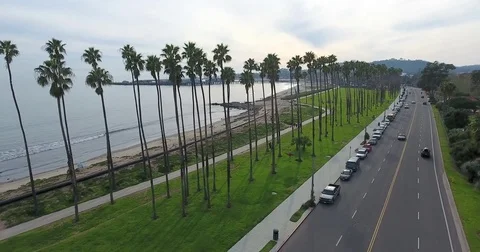 Flying over Cabrillo Boulevard on Santa Barbara, California coast Stock Footage 73205498