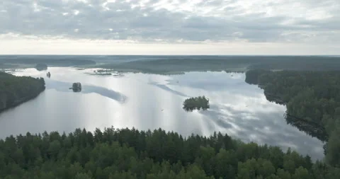 Flying over a calm lake Stock Footage 282890020