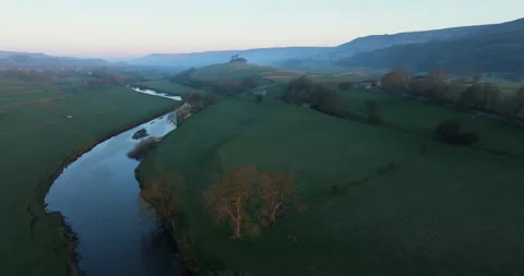 Flying over calm river and valley Stock Footage 307360600