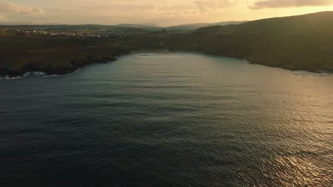 Flying Over The Calm Sea During Sunset In Malpica, A Coruña, Spain. - aerial Vidéo 240482111