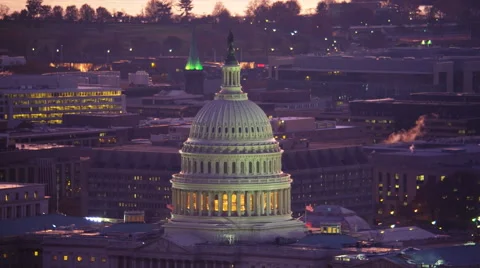 Flying over Capitol Hill near the Capitol dome at dusk, Washington DC. Shot in Vídeo Stock 59190734