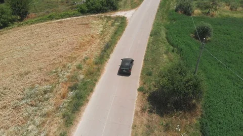 Flying over car driving on empty country road. Nature,wild,holydays Stock Footage 99079468
