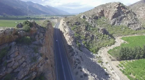 Flying Over Car Driving Through Mountain Road Tunnel Aerial Shot Stock Footage 65078157