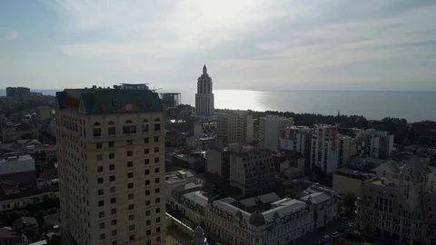 Flying over the centre of Batumi in the backlight. Aerial view. Stock-Footage 90920638